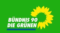 Parteilogo von Bündnis 90/Die Grünen mit den stilisierten Blütenblättern einer Sonnenblume